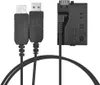 A black camera battery dummy charger kit with two USB cables and a dummy battery adapter. Náhled obrázku produktu