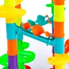 A close-up view of a colorful plastic marble run toy. Produktbild-Vorschau
