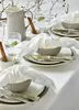 A table setting with plates, cutlery, napkins, and a pitcher, suggesting a meal or gathering. Produktbild-Vorschau