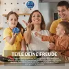 A family playing with a flying ball indoors. Produktbild-Vorschau