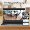 A laptop and a smartphone are displayed side-by-side, showing a live feed from a security camera. The laptop displays a wide-angle view of an indoor space, while the smartphone shows a fisheye perspective of the same space. Produktbild-Vorschau