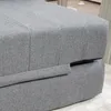 A close-up view of a gray upholstered sofa or ottoman. Náhled obrázku produktu