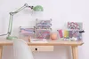 A desk with art supplies and storage boxes. Produktbild-Vorschau