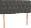 A dark gray tufted headboard with wooden legs against a white background. Produktbild-Vorschau