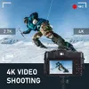 A digital camera is shown in the foreground, with a dynamic image of a person skiing in the background, suggesting the camera's capabilities for action shots. Produktbild-Vorschau
