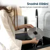 A person is washing a metal disc under a faucet in a sink. Náhled obrázku produktu