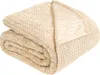 A folded beige blanket with a textured pattern. Anteprima dell’immagine prodotto