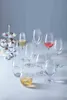 A collection of wine glasses and desserts on a table. Podgląd zdjęcia produktu