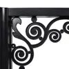 A close-up view of a black metal decorative bracket with scrollwork. Náhľad obrázku produktu