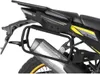 A close-up view of a motorcycle's rear section, showing a luggage rack and exhaust system. Podgląd zdjęcia produktu