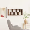 A living room scene with a wall shelf, armchair, and a side table with a vase. Anteprima dell’immagine prodotto