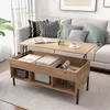 A modern living room with a couch and a wooden coffee table with its top lifted to reveal storage. Anteprima dell’immagine prodotto