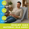 A man is sitting on a foldable mattress and reading a book. The mattress is folded into a sitting position, and there are graphic overlays on the left side of the image. Podgląd zdjęcia produktu
