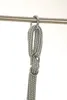 A close-up of a metal hook and rope assembly hanging from a metal bar. Podgląd zdjęcia produktu