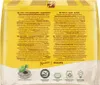 The back of a coffee pad packaging with multiple languages describing the product and its features. Produktbild-Vorschau