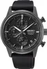 A close-up, front-facing studio shot of a black Seiko chronograph watch with a black dial and a black rubber strap. Produktbild-Vorschau