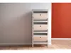 A white shoe cabinet with three drawers is placed against a light gray wall, with a red wall on the right. The floor is made of light wood. Produktbild-Vorschau