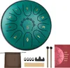 A teal steel tongue drum with gold numbering and accessories laid out on a white background. Podgląd zdjęcia produktu