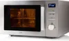 A silver Domo microwave oven is shown from a slight angle against a white background. Náhled obrázku produktu