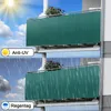 Two balconies with green privacy screens, one under sunny skies and the other in the rain. Produktbild-Vorschau