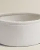 Close-up shot of the rim of a round, fabric storage basket. Náhled obrázku produktu
