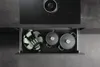 A kitchen drawer with cookware, beneath an induction cooktop. Produktbild-Vorschau