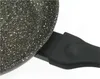 Close-up of the handle and edge of a granite frying pan. Anteprima dell’immagine prodotto