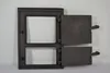 A dark gray cast iron oven door with two hinged flaps, shown against a white background. Anteprima dell’immagine prodotto