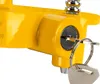 A close-up view of a yellow hitch lock with a key inserted. Produktbild-Vorschau