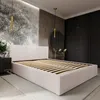 A bedroom with a bed, wardrobe, and decorative elements. Náhled obrázku produktu