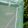 A close-up view of a green greenhouse cover with a white zipper and a white strap. Produktbild-Vorschau