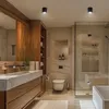 A modern bathroom with a vanity, toilet, and shower. Produktbild-Vorschau