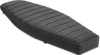 A black motorcycle seat with a ribbed texture is shown from a diagonal angle against a white background. Voir les images du produit