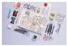A flat lay of journaling supplies including an open notebook, pens, photos, stickers, and sticky notes. Anteprima dell’immagine prodotto