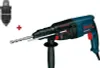 A Bosch hammer drill with a drill bit and an additional chuck are displayed against a white background. Náhled obrázku produktu