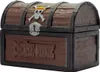 A close-up, front-facing view of a treasure chest-shaped cookie tin, designed to resemble aged wood with metal accents. It features the One Piece Jolly Roger logo on the lid and the series title embossed on the front. Anteprima dell’immagine prodotto