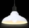 A white pendant lamp with a black top, hanging against a black background. Náhľad obrázku produktu