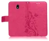 A pink flip case for a Samsung Galaxy J3 2017 is shown open, displaying its interior and embossed floral pattern. Produktbild-Vorschau