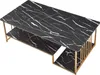A rectangular coffee table with a black marble-like top and gold-colored legs and supports. Voir les images du produit