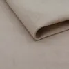 A close-up shot of a folded piece of beige fabric, possibly upholstery or a soft textile. Náhled obrázku produktu