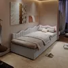 A bedroom scene with a bed, artwork on the wall, and curtains in the background. Produktbild-Vorschau