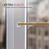A close-up of a gold curtain rod mounted on a window frame using clear adhesive hooks. Anteprima dell’immagine prodotto