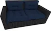 A dark blue cushion set on a black wicker sofa. Produktbild-Vorschau