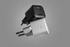 Two power adapters are stacked on a gray background. Podgląd zdjęcia produktu