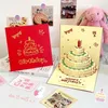 A collection of birthday cards and small decorative items, including a pink bunny plush toy, on a desk. Podgląd zdjęcia produktu