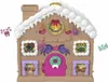 A festive gingerbread house advent calendar with Christmas decorations. Podgląd zdjęcia produktu