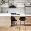 A modern kitchen with two black bar stools in the foreground. Náhľad obrázku produktu