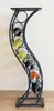 A wine rack with bottles of wine against a plain background. Anteprima dell’immagine prodotto
