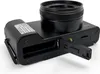 A black digital camera with its battery compartment open, shown from a rear-diagonal angle on a white background. Náhľad obrázku produktu