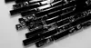A close-up, angled view of black mosaic tiles. Anteprima dell’immagine prodotto